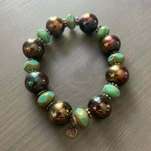 Beautiful, one of a kind porcelain raku bead bracelet.